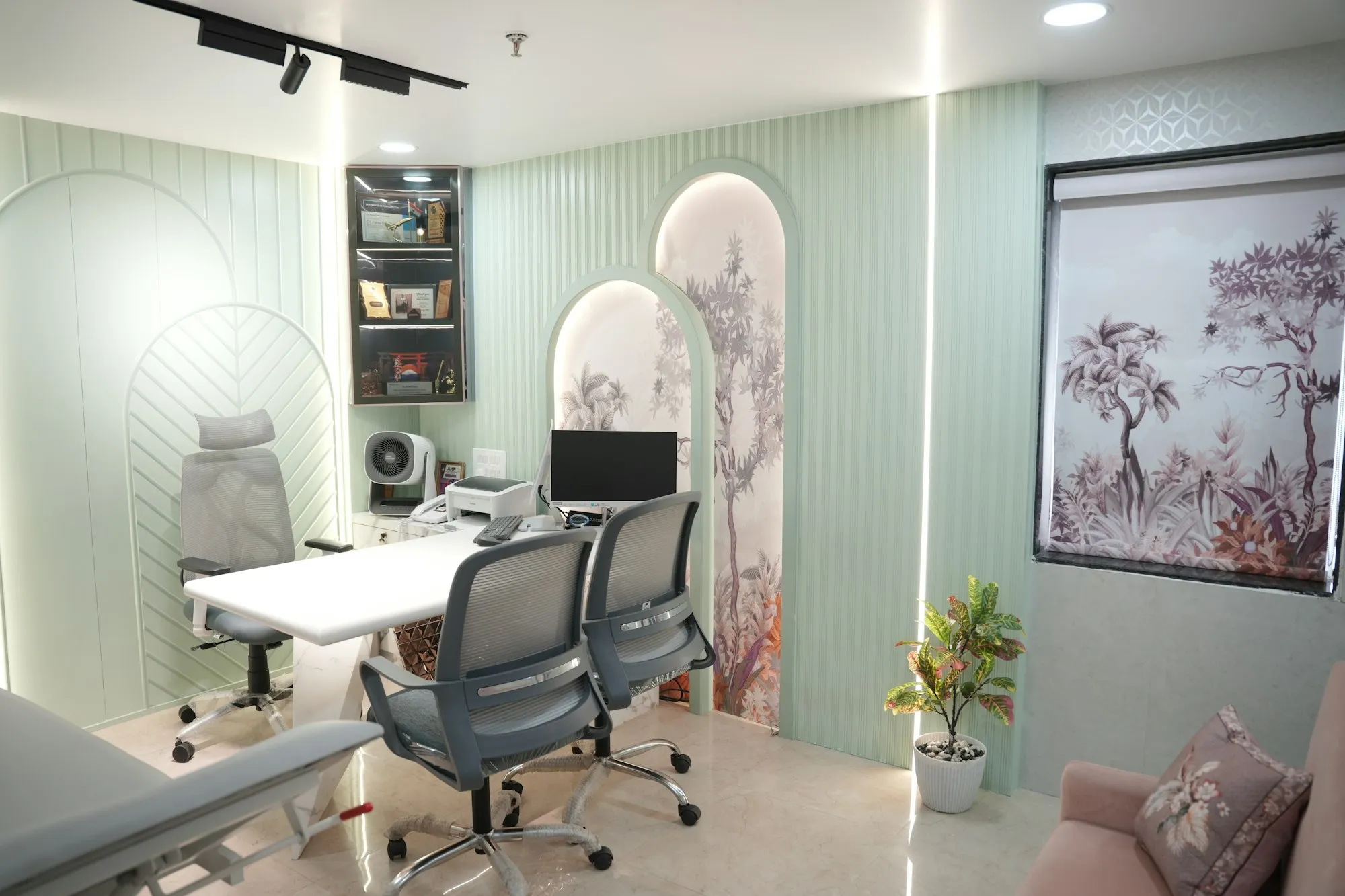 A clinic office with a desk and computer