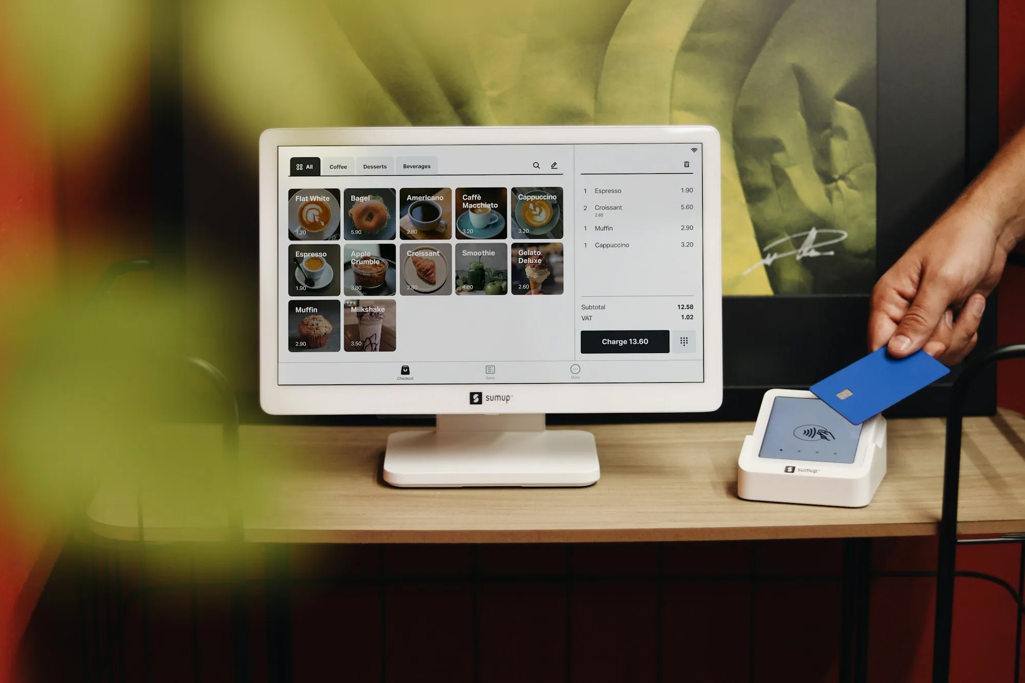 A point-of-sale terminal and card reader on a shop counter