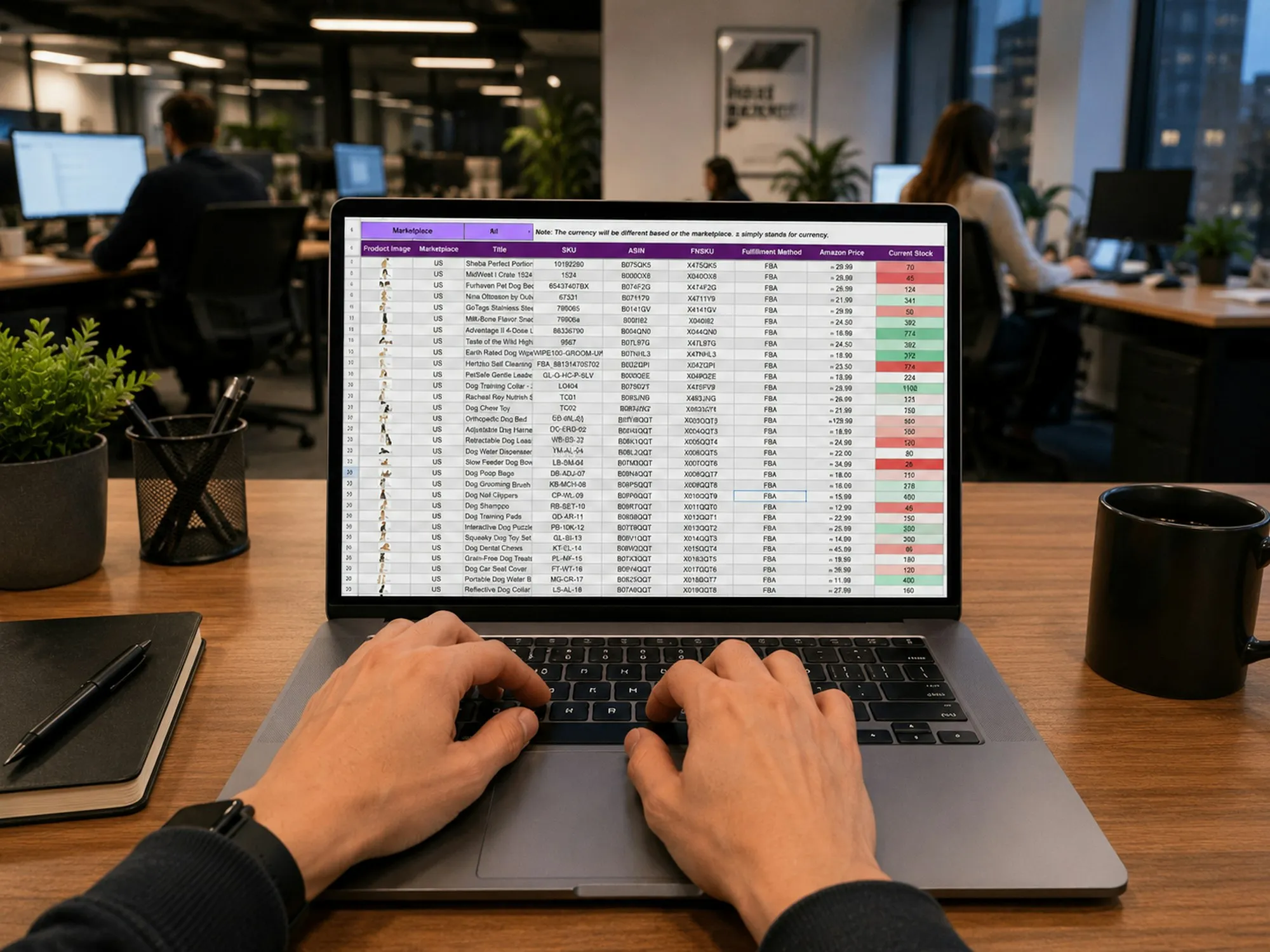 Hands typing on a laptop showing a spreadsheet